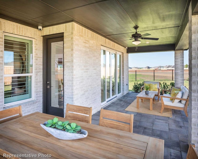 view of patio featuring ceiling fan