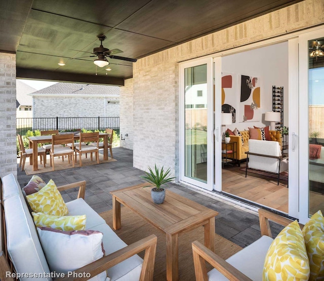 view of patio with ceiling fan and an outdoor hangout area