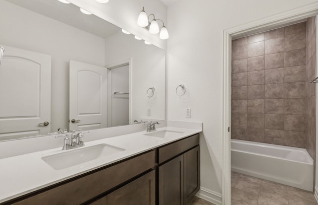 bathroom with vanity, tile patterned floors, and tiled shower / bath