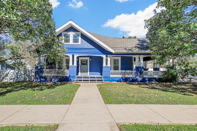 view of front of property with a front lawn and a porch