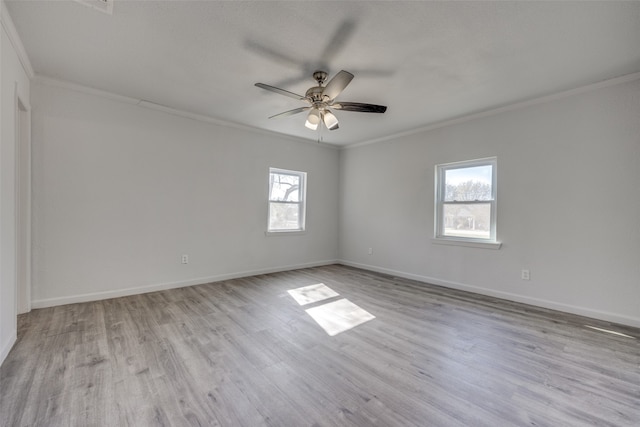 empty room with light wood-type flooring, crown molding, ceiling fan, and a healthy amount of sunlight