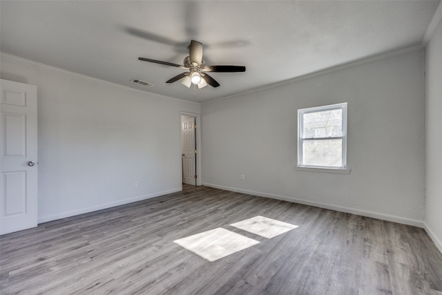 unfurnished room with light hardwood / wood-style floors, ceiling fan, and ornamental molding