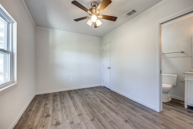 unfurnished bedroom with multiple windows, ceiling fan, and light hardwood / wood-style flooring