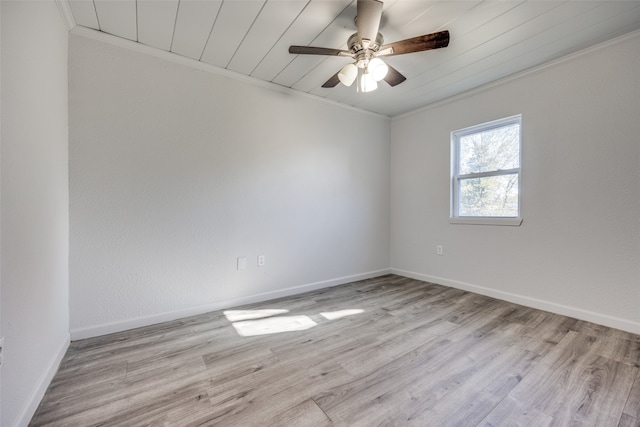 empty room with light hardwood / wood-style flooring, ceiling fan, and crown molding