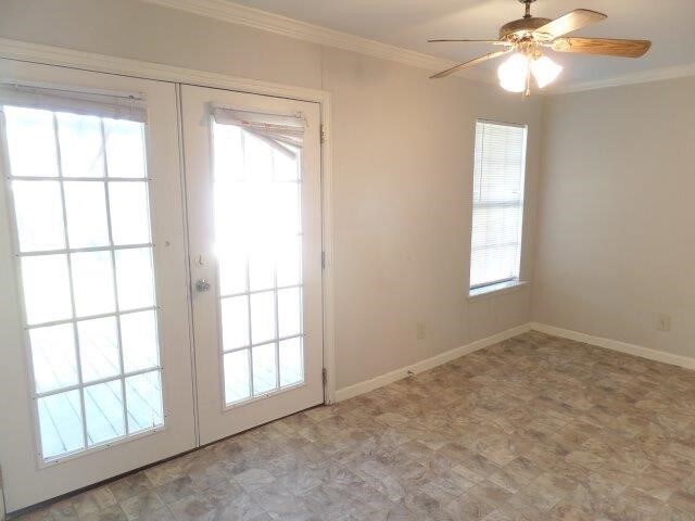 doorway featuring french doors, ceiling fan, and ornamental molding