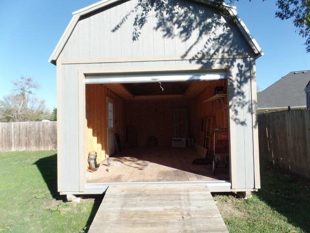 garage with a yard