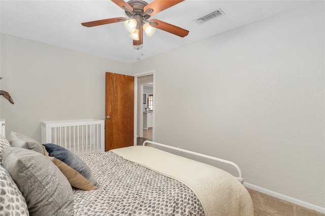 carpeted bedroom with ceiling fan