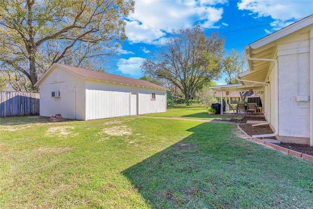 view of yard featuring a wall mounted air conditioner and a storage shed