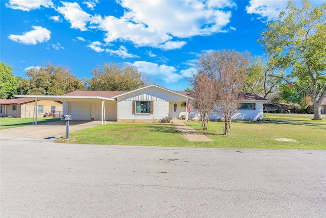 ranch-style home with a front lawn and a carport