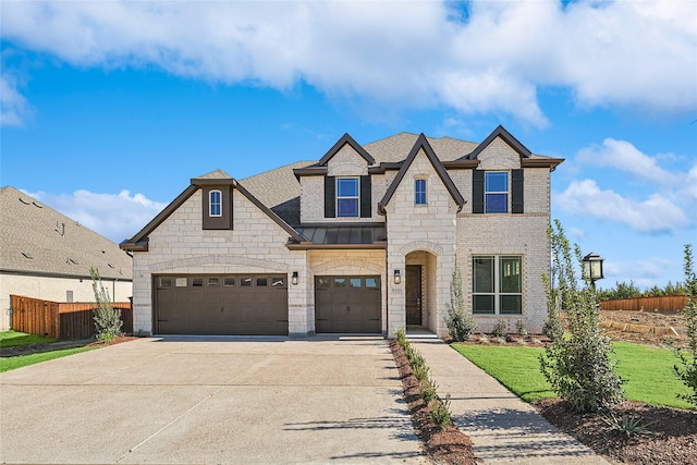 view of front of home with a garage and cooling unit