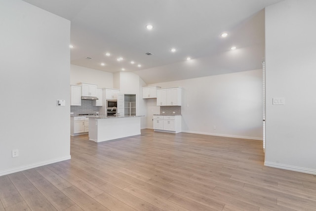 unfurnished living room featuring light wood-type flooring