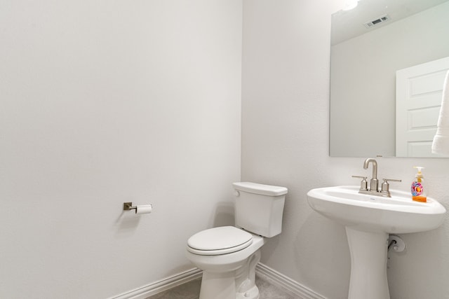 bathroom featuring toilet