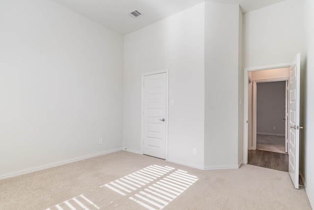 unfurnished bedroom with light carpet