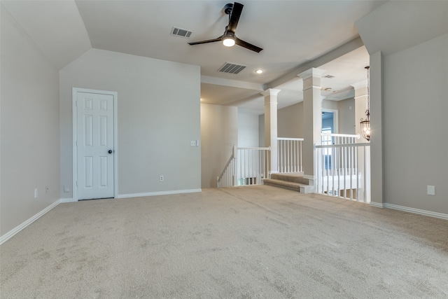 empty room with ceiling fan, carpet floors, and vaulted ceiling