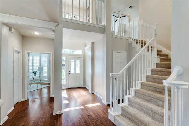 foyer featuring a high ceiling and hardwood / wood-style flooring