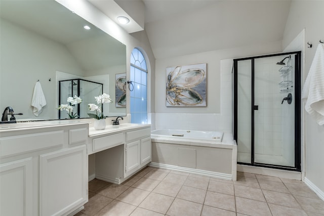 bathroom with tile patterned flooring, vanity, separate shower and tub, and lofted ceiling