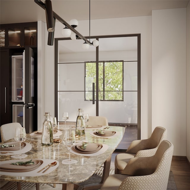 dining area with hardwood / wood-style flooring