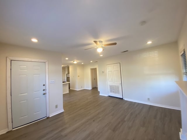 interior space featuring ceiling fan and dark hardwood / wood-style flooring