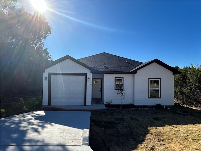 single story home featuring a garage