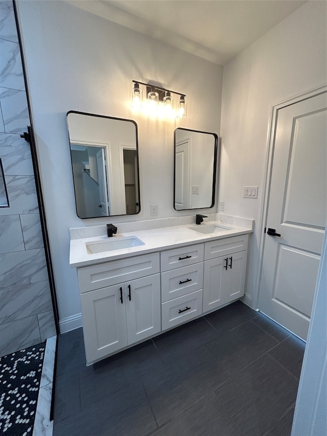 bathroom featuring tile patterned floors and vanity