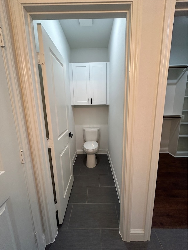 bathroom with tile patterned floors and toilet