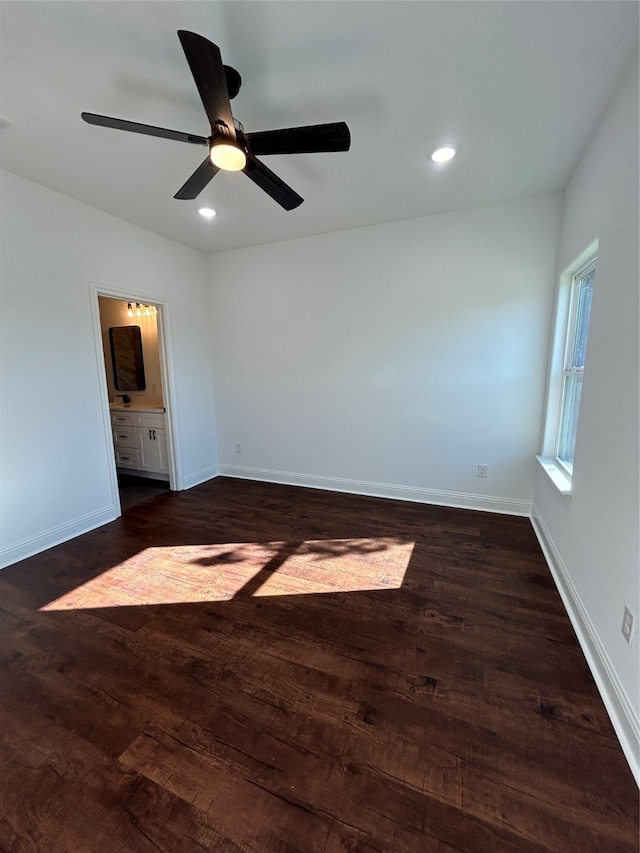 empty room featuring dark hardwood / wood-style floors and ceiling fan