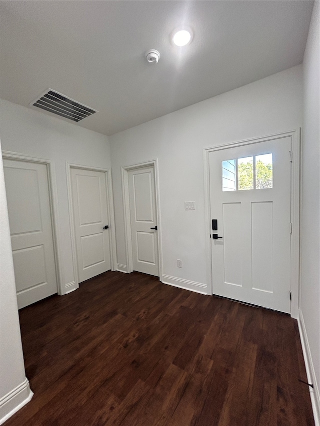 entryway with dark wood-type flooring