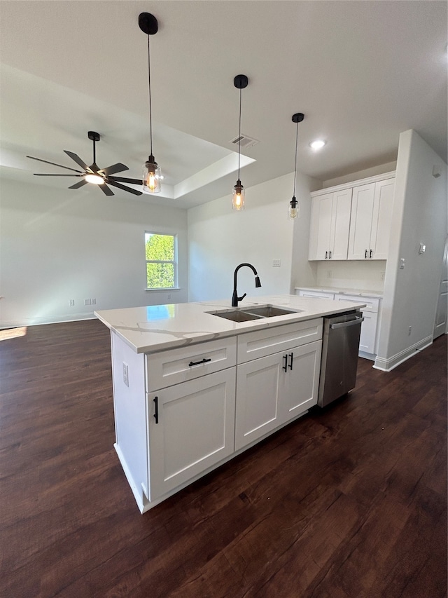 kitchen featuring white cabinets, dishwasher, a center island with sink, and sink