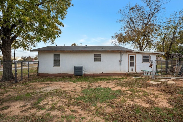 rear view of property featuring central air condition unit