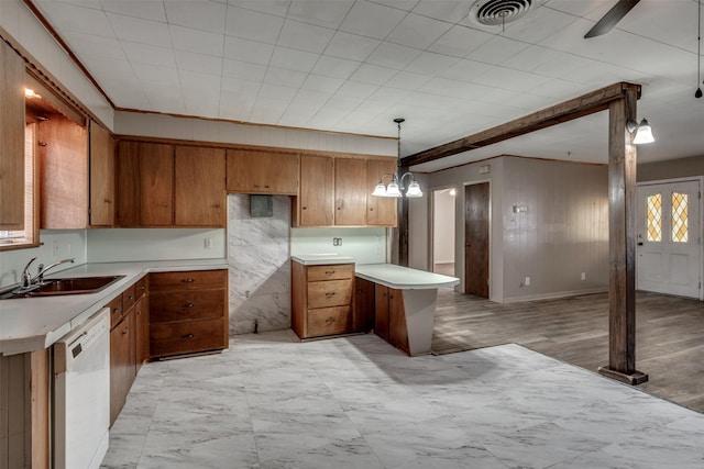 kitchen featuring ornamental molding, sink, dishwasher, light hardwood / wood-style floors, and hanging light fixtures