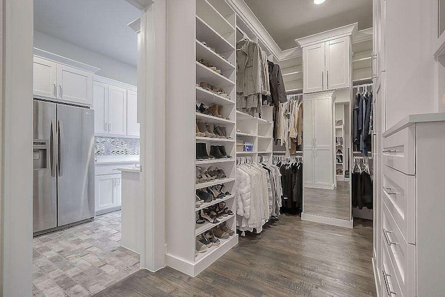 walk in closet featuring wood-type flooring