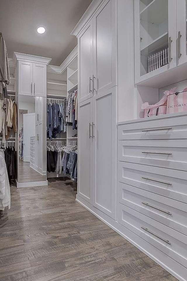 spacious closet with dark hardwood / wood-style flooring