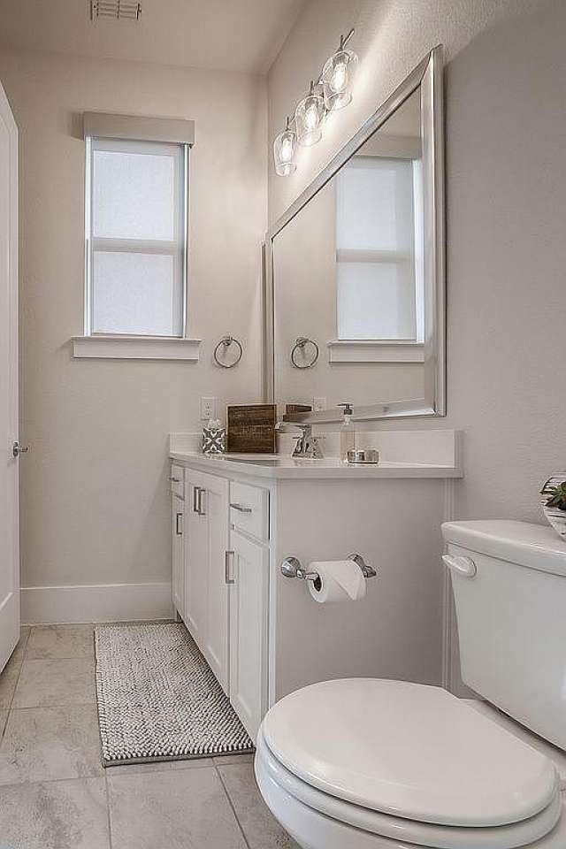 bathroom featuring tile patterned flooring, vanity, and toilet