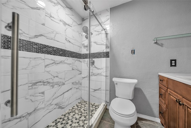 bathroom with vanity, toilet, and an enclosed shower