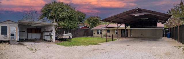 exterior space with a lawn and a carport