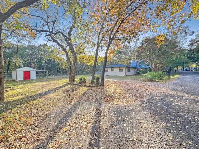 exterior space featuring an outbuilding and a storage unit