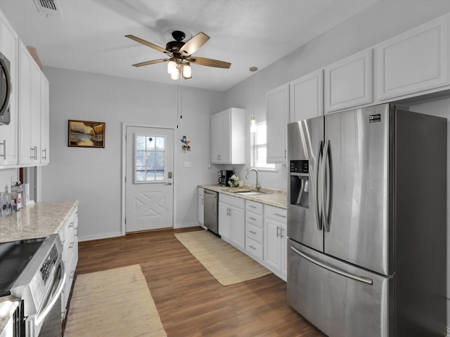 kitchen featuring appliances with stainless steel finishes, ceiling fan, sink, white cabinets, and dark hardwood / wood-style floors