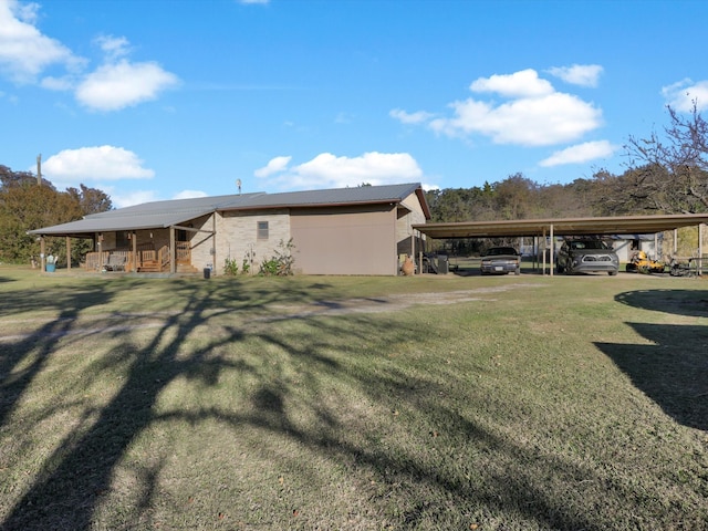 exterior space featuring a carport and a yard