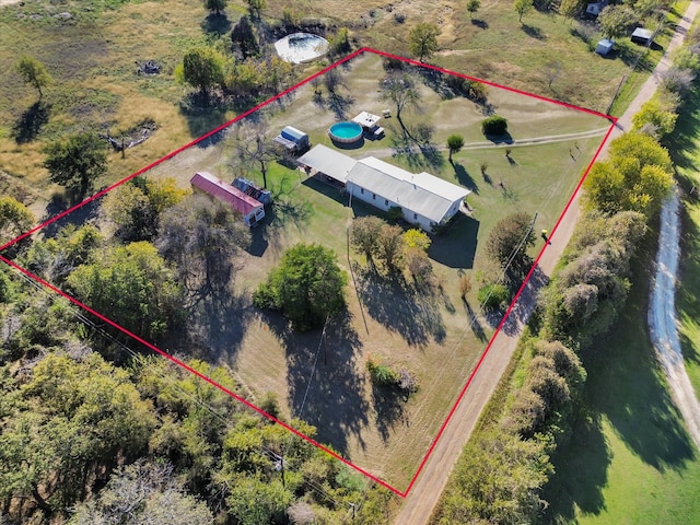 birds eye view of property with a rural view