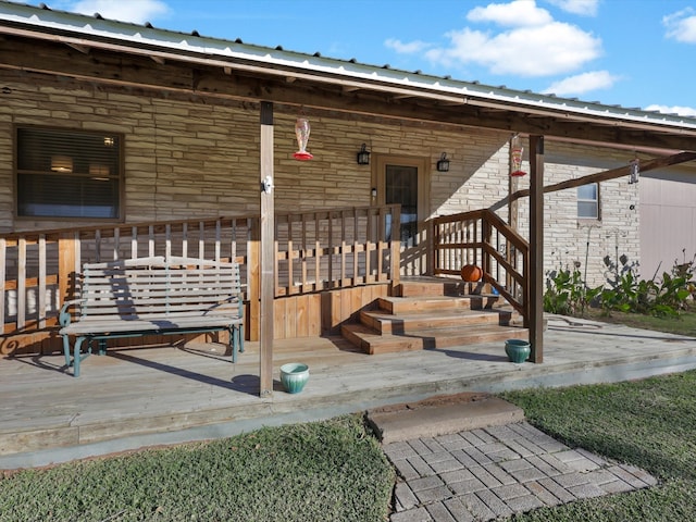 view of exterior entry with covered porch