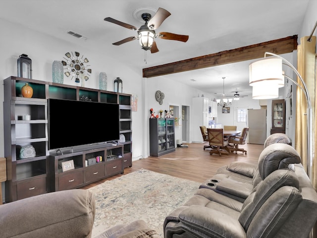 living room with beamed ceiling and light hardwood / wood-style floors