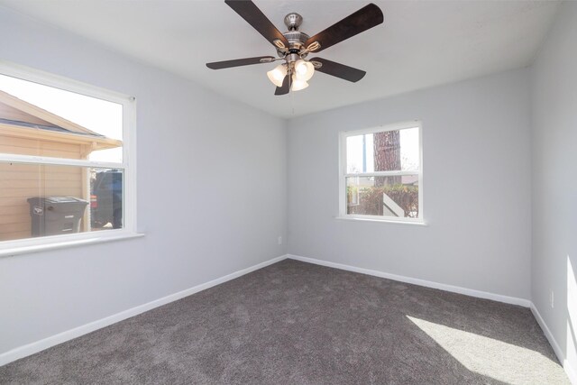 carpeted empty room featuring ceiling fan