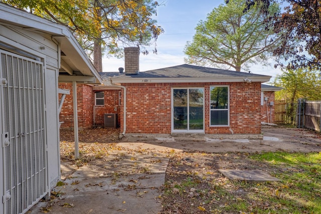 back of property with central AC unit