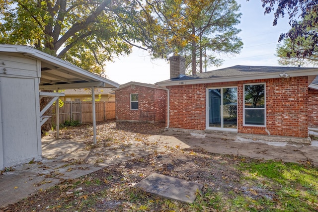 rear view of property featuring a patio