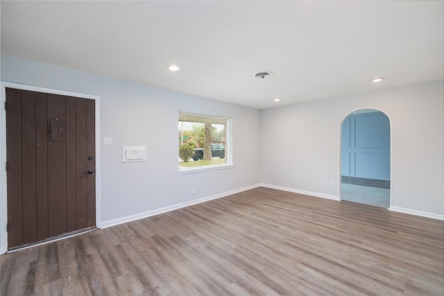 empty room with hardwood / wood-style floors