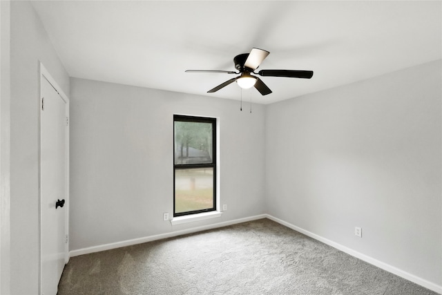 unfurnished room featuring carpet floors and ceiling fan