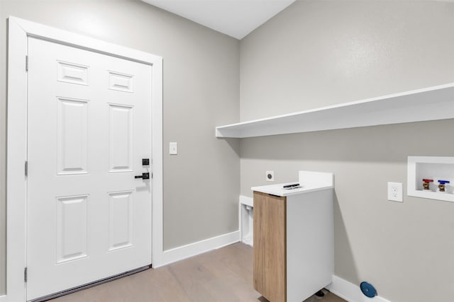 laundry room featuring hookup for an electric dryer, hookup for a washing machine, and light hardwood / wood-style floors