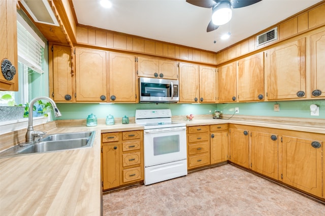 kitchen with ceiling fan, sink, and white electric range oven