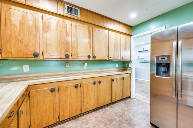 kitchen featuring stainless steel fridge