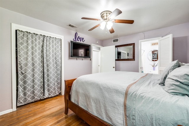 bedroom featuring wood-type flooring and ceiling fan